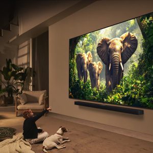 LG 100 inch QNED evo wall-mounted in modern living room with soundbar