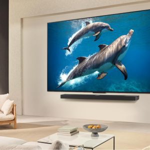 LG 55 inch QNED TV wall-mounted in modern living room with soundbar