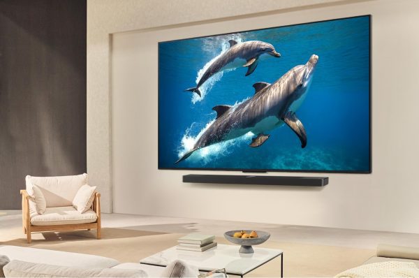 LG 75 inch QNED TV wall-mounted in modern living room with soundbar