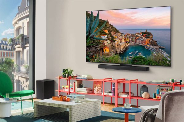 LG 77 inch OLED evo wall-mounted in modern living room with soundbar